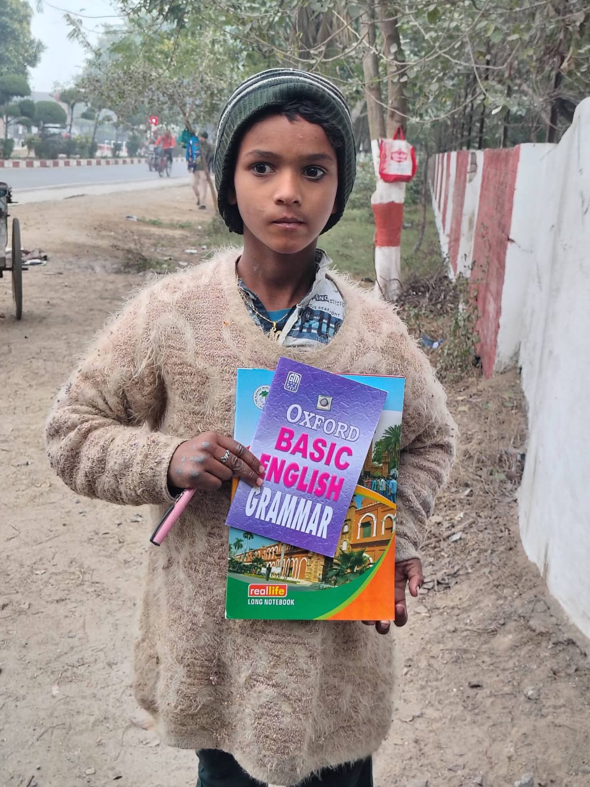 Boy holding a grammar book