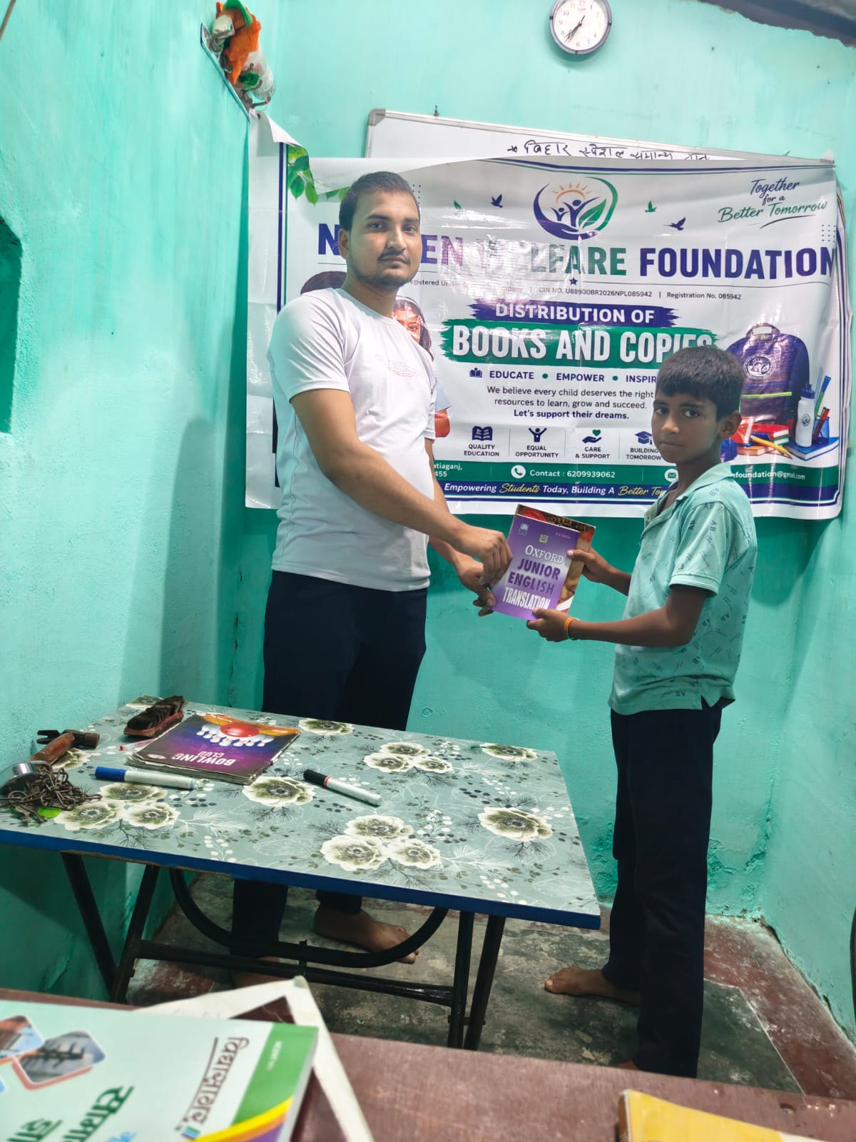 Children receiving educational books