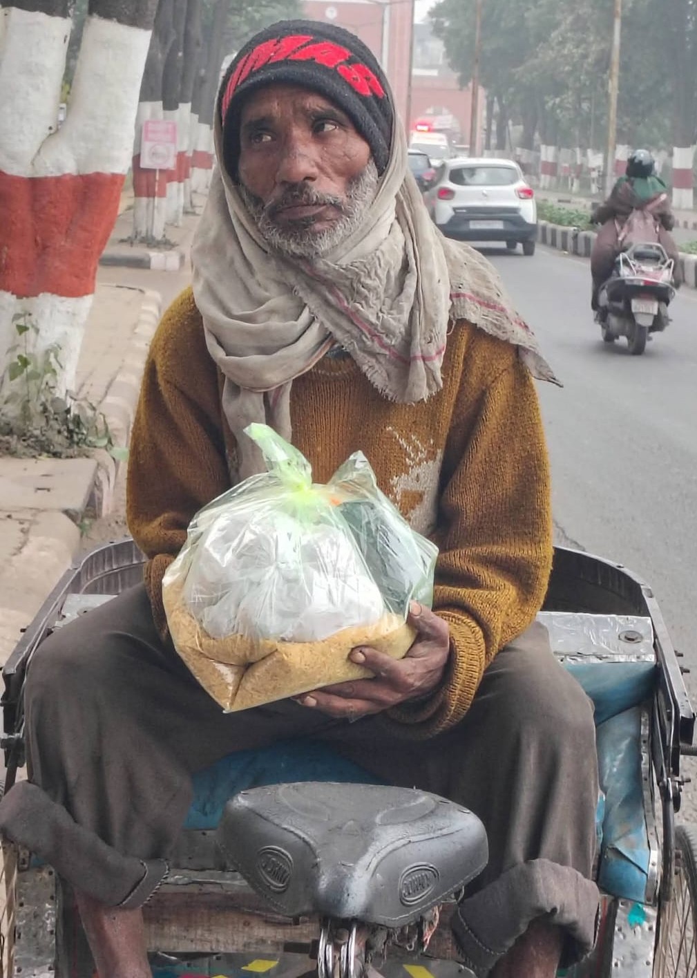 Elderly man receiving food relief